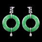 Jade Circle Earrings accompanied by Diamonds and two Rubies. Set in 14 karat White Gold.