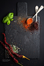 Herbs and spices on black slate stone board over dark background. by Anna Ivanova on 500px