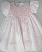 Stunning hand smocked babies dress.