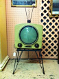 Vintage TV with “porthole” screen in vivid lime cabinet #retrohomedecor
