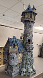 This may contain: a model of a castle with skulls on the ground