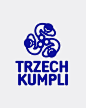 This may contain: a blue and white logo with the words trzech kumpli on it