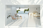 A white room with a view of the ocean