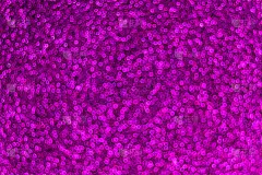 假日紫色的散景背景配上闪闪发光的光环