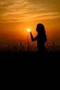 girl holding the sun in her palm by Catalin Grigoriu on 500px