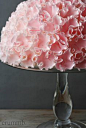 Crummb. Dome-shaped cake covered with a layer of fondant, on which about 100 ruffle-blossoms are attached.