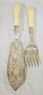 HALLMARKED ENGLISH 2 PC SERVING SET W/CARVED IVORY HANDLES & ELABORATE ENGRAVING OF BIRDS & FLOWERS; MARKED A & D W/CROWN, LION AND C. RD