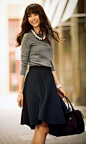 Work circle skirt, gray sweater, statement necklace, sleek cuff.