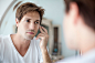 Man looking at self in mirror with concern about his complexion by photoalto on 500px