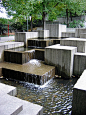 Freeway Park in Seattle combines lush landscaping with concrete containers, walls and a concrete water feature.  Photo by Charles Birnbaum:: :: The Cultural Landscape Foundation