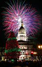 Fireworks explode over the state Capitol following the lighting of the state Christmas tree on November 16, 2012, in Lansing, Mich.