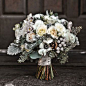 made with mini cymbidium orchids, silver brunia, juniper sprigs, pine boughs, anemones, pinecones, garden spray roses, seeded eucalyptus, Vendela roses, and dusty miller  www.wrennwooddesign.com  Atlanta, GA