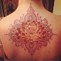 Red lotus tattoo on the back for girls