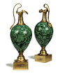 A PAIR OF RUSSIAN GILT-METAL MOUNTED MALACHITE ORNAMENTAL EWERS  SECOND QUARTER 19TH CENTURY  The baluster bodies with scroll handles on waisted socles and square section bases  10½ in. (26.6 cm.) high (2): 