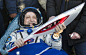 International Space Station crew member Russian cosmonaut Fyodor Yurchikhin holds the torch of the 2014 Sochi Winter Olympic Games after landing near the town of Zhezkazgan in central Kazakhstan, on November 11, 2013.?(Reuters/Shamil Zhumatov)