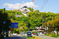 Tram and Kumamoto Castle Under repair, Kumamoto Prefecture, Japan创意图片素材 - Imagenavi RF