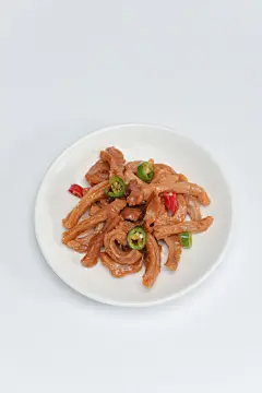 咸香鲜椒黄牛筋卤味卤菜美食摄影图