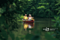 Senior couple paddling canoe