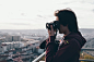 Man in Maroon Jacket Using Camera
