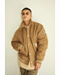 Photo by Shawn Yue on September 02, 2023. May be an image of 1 person, duffle coat, overcoat, fleece, parka and flight jacket.
