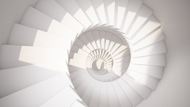 白色螺旋楼梯在阳光下抽象的内部