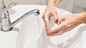 person-washing-hands-with-soap_23-2148602173