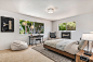 Example of a trendy carpeted and beige floor bedroom design in Santa Barbara with white walls