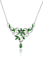 Jadeite Flower Necklace 18K white gold floral design necklace.  Cabochon cut intense green Jadeite set in a very feminine flower and leaf pattern.  Accented by 200 pave set round brilliant cut diamonds for a total weight of 1.23ct.