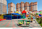 The playground in the courtyard of a new kindergarten with new residential buildings in the background. Rostov-on-Don / Russia - 7 may 2019