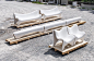 A modern outdoor furniture collection made from 3D printed white concrete.