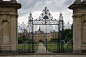 Oxford, UK - August 27, 2014: Oxford College in Oxford, UK. The historic building is part of Oxford University . Detail view of an antique fancy fence