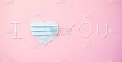 题字、文字“我爱你”用蓝心做成，用医用口罩切成片。情人节。创意贺卡的节日。冠状病毒大流行,covid