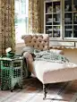 A printed chaise and Moroccan side table animate another corner of the guest room.