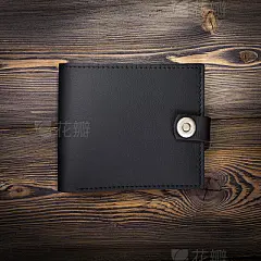 leather wallet on rustic wood background