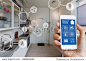 Smart home technology interface on smartphone app screen with augmented reality (AR) view of internet of things (IOT) connected objects in the apartment interior, person holding device