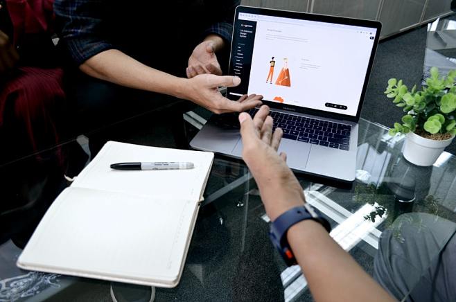 person using macbook...