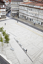 The Praça do Toural, Portugal. Trapezoidal space anchored by old fountain and renovated with new paving that looks like a map of the town.