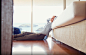 Caucasian woman relaxing on living room floor / 500px