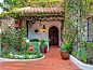 Spanish style- everything about this is a home that I'd love. I'd love the trellises. I'd love the terracotta tiles, the roofs, the little fountain and the wooden door.: 