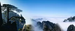 云雾中的黄山迎客松3440x1440壁纸