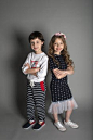 Two Boy and Girl Standing Wearing Clothe