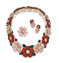 SUITE OF RED & PINK CORAL & DIAMOND 'ROSE DE NOEL' JEWELRY, VAN CLEEF & ARPELS, PARIS.  Necklace composed of alternating red & pink coral flowers, the centers decorated with clusters of round diamonds, the leaves of dyed green chalcedony, 