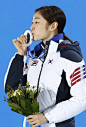 SOCHI Russia Kim Yu Na of South Korea kisses her silver medal during an award ceremony for the women's figure skating event at the Winter Olympics in...