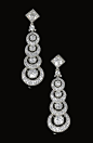 Pair of diamond pendent ear clips, Cartier, Circa 1910