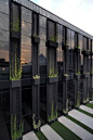 Black on black on black. But mostly, look at those proportions and innovative vertical gardens incorporated into the architecture.