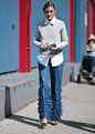 olivia palermo wearing jeans and a gray sweater