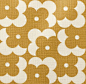 This may contain: an orange and white pattern on fabric with small circles in the shape of letters,