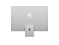 银色 iMac 的背面外观，Apple 标志位于机身中央，其颜色比深色机身外观浅几个色调，底座与 Apple 标志同色，底座上带有线缆孔位，两个 USB-C 端口和两个雷雳端口位于机身左下方，电源按钮位于机身右下方。