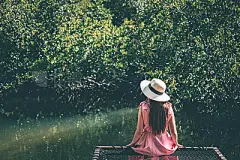 Woman relaxing in mangrove forest Lagoon vacation timeWoman relaxing in mangrove forest Lagoon vacation time