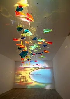 &quot;Looking at two cities from one point of view&quot;, Rashad Alakbarov, Acrylic paper planes and projected light